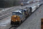 Manifest rolls north past the yard in the rain